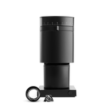 Black coffee grinder with a few components on a white background. fellow ode conical grinder.
